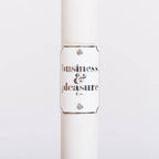 white umbrella pole with badge and logo