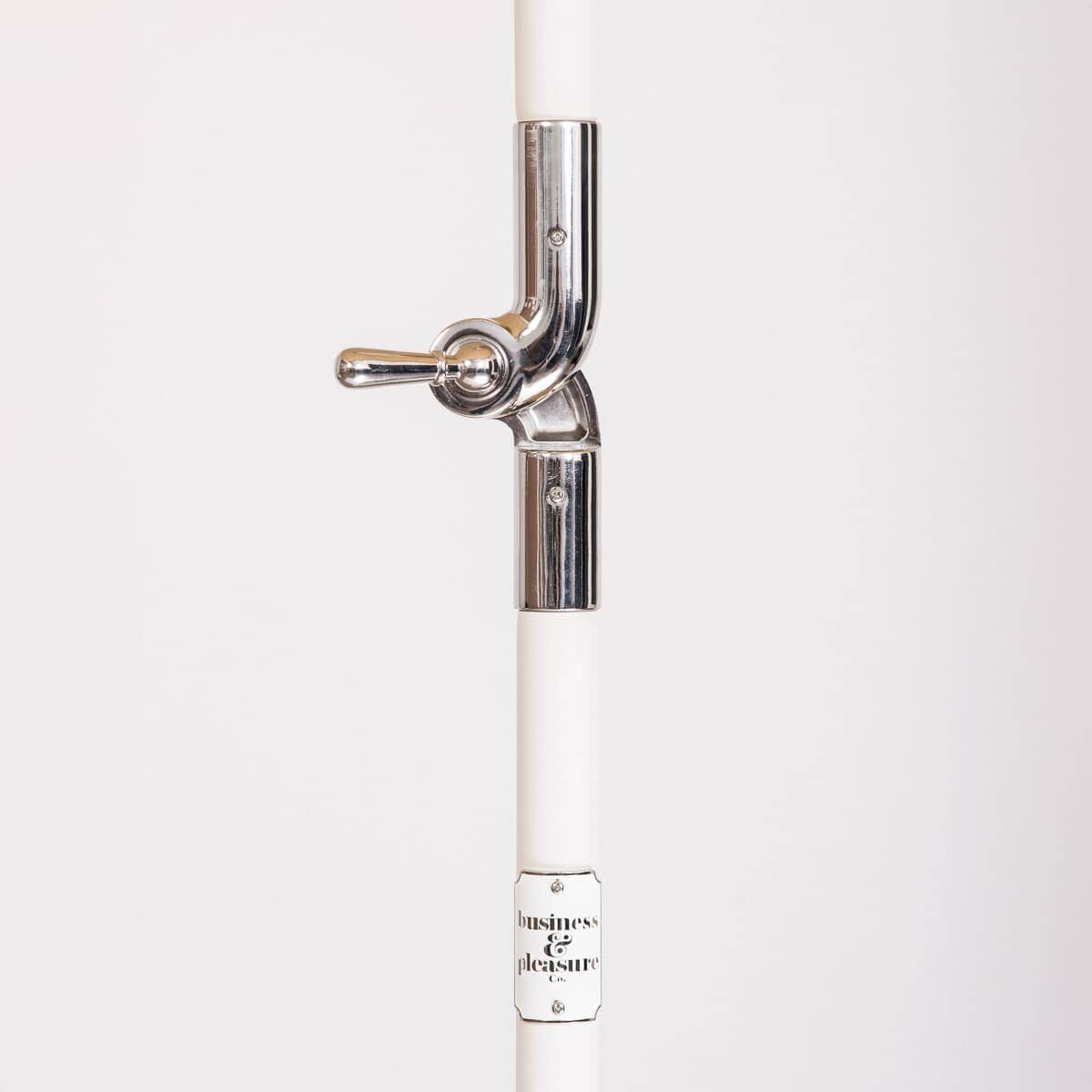 white umbrella pol and chrome hinge detail