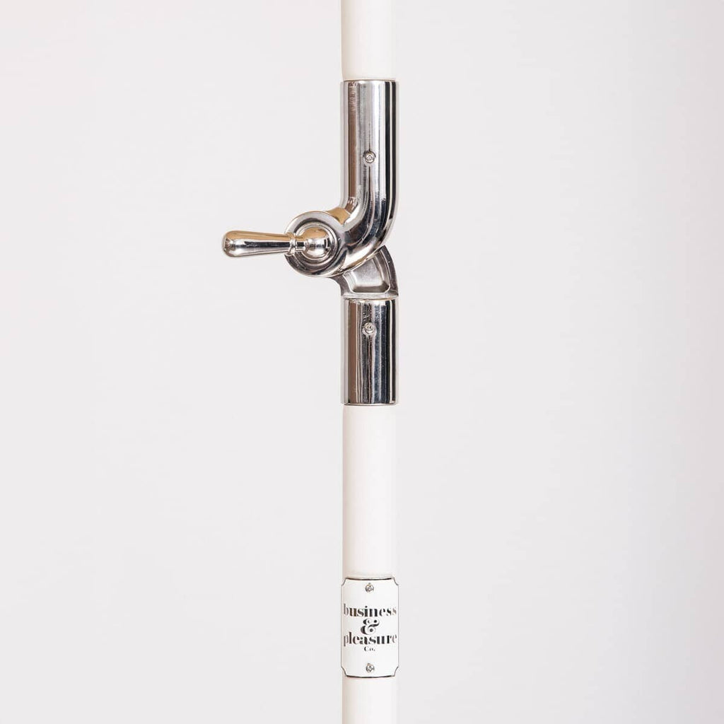 white umbrella pol and chrome hinge detail