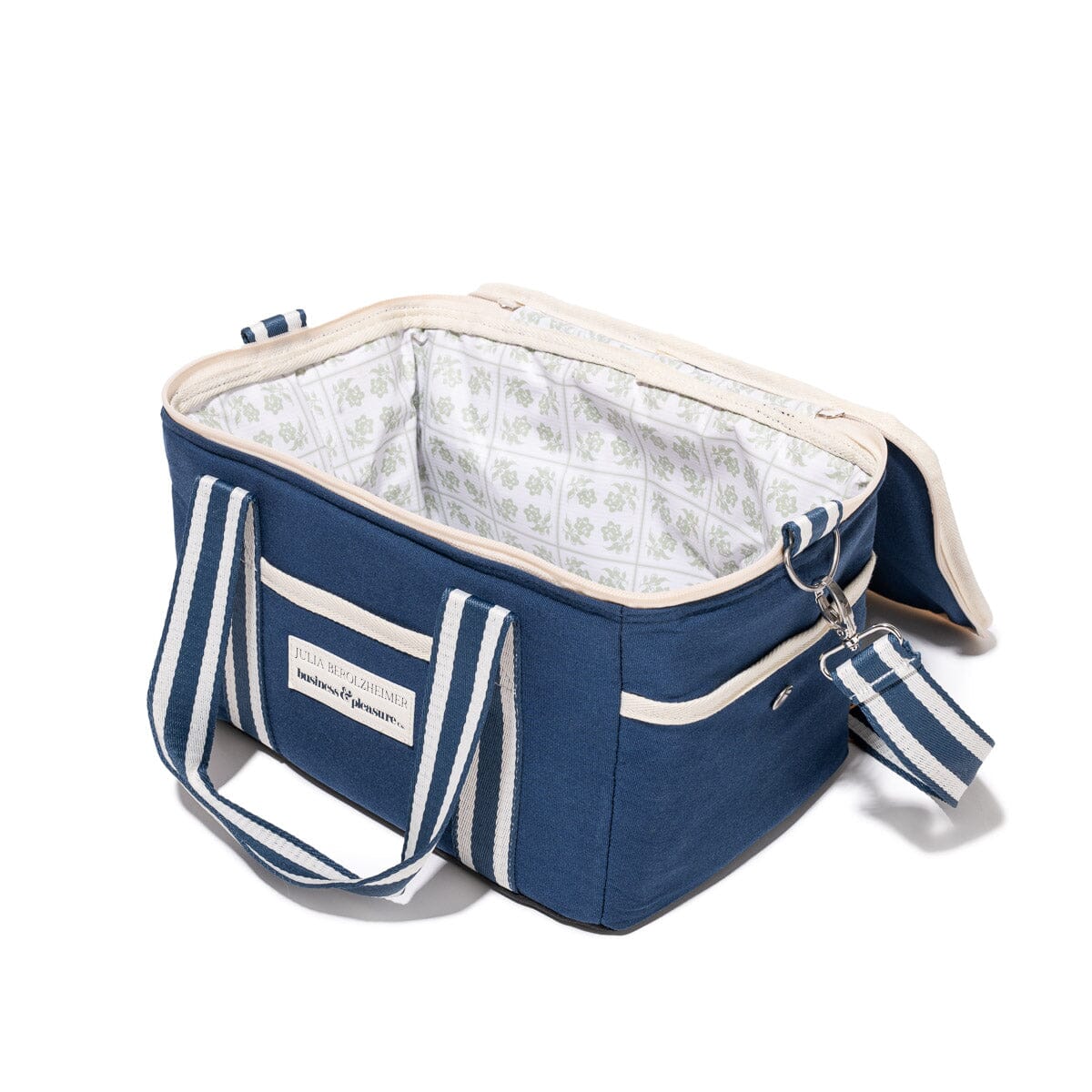 Blue cooler bag with white interior and matching tag on a white background