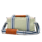 Green bag with striped strap and brown leather accents on a white background