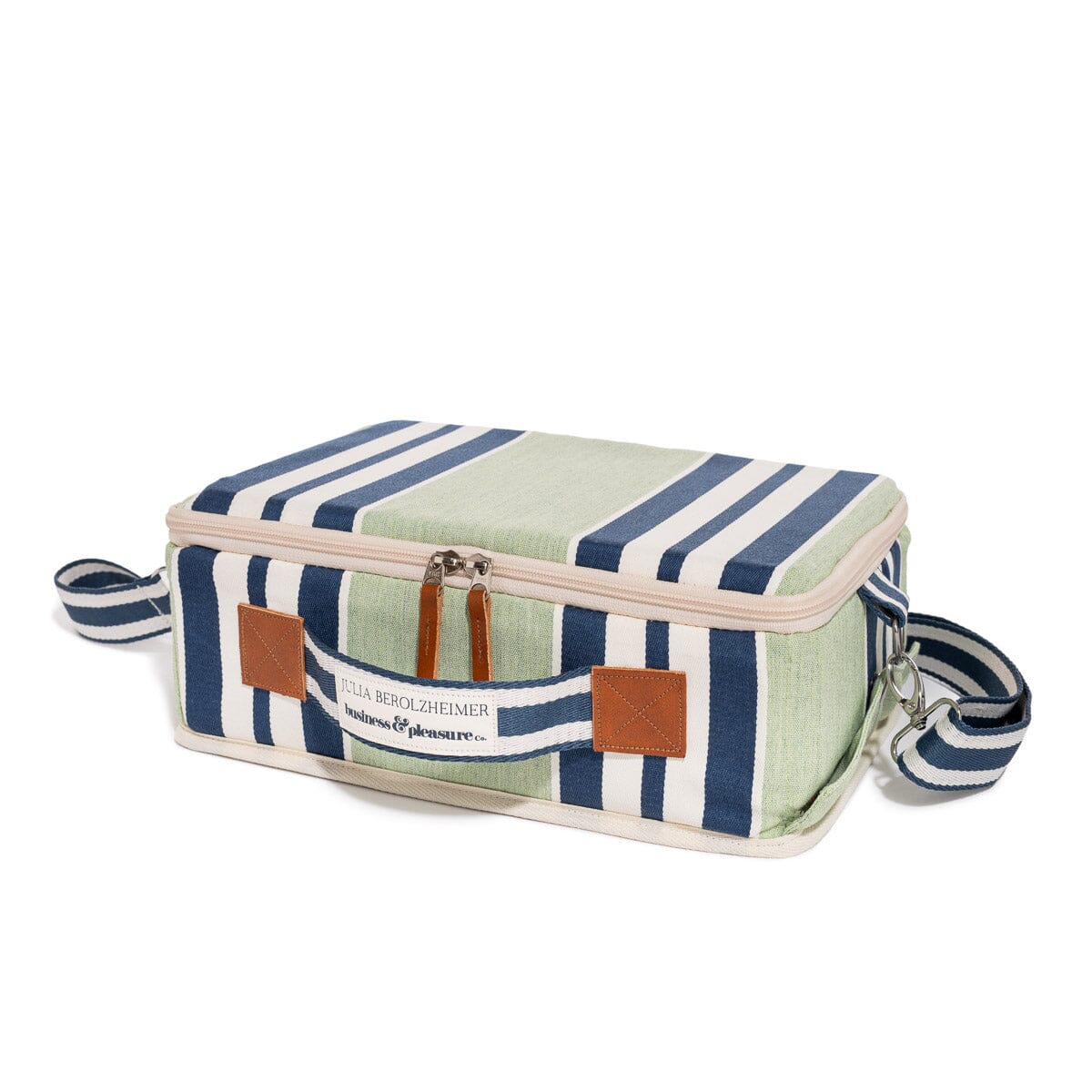 Striped cosmetic bag with leather accents on a white background