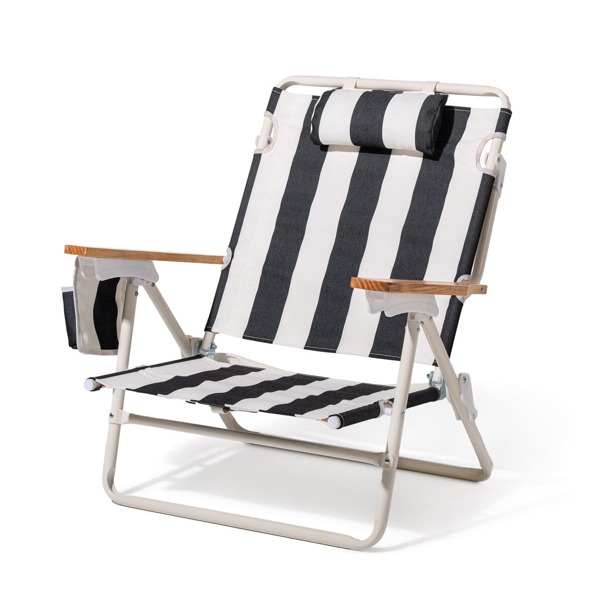 Black and white striped beach chair with wooden armrests on a white background