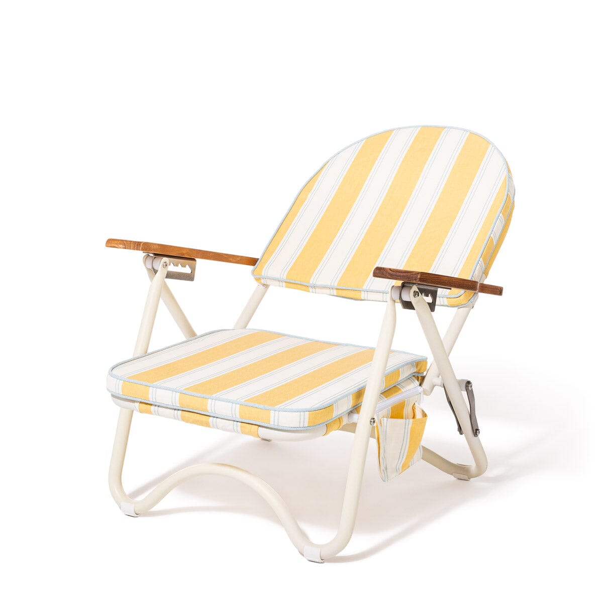Yellow and white striped folding beach chair on a white background