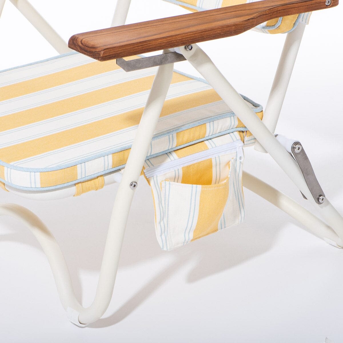Close-up of a lounge chair with yellow and white striped cushions and a wooden armrest on a white background.
