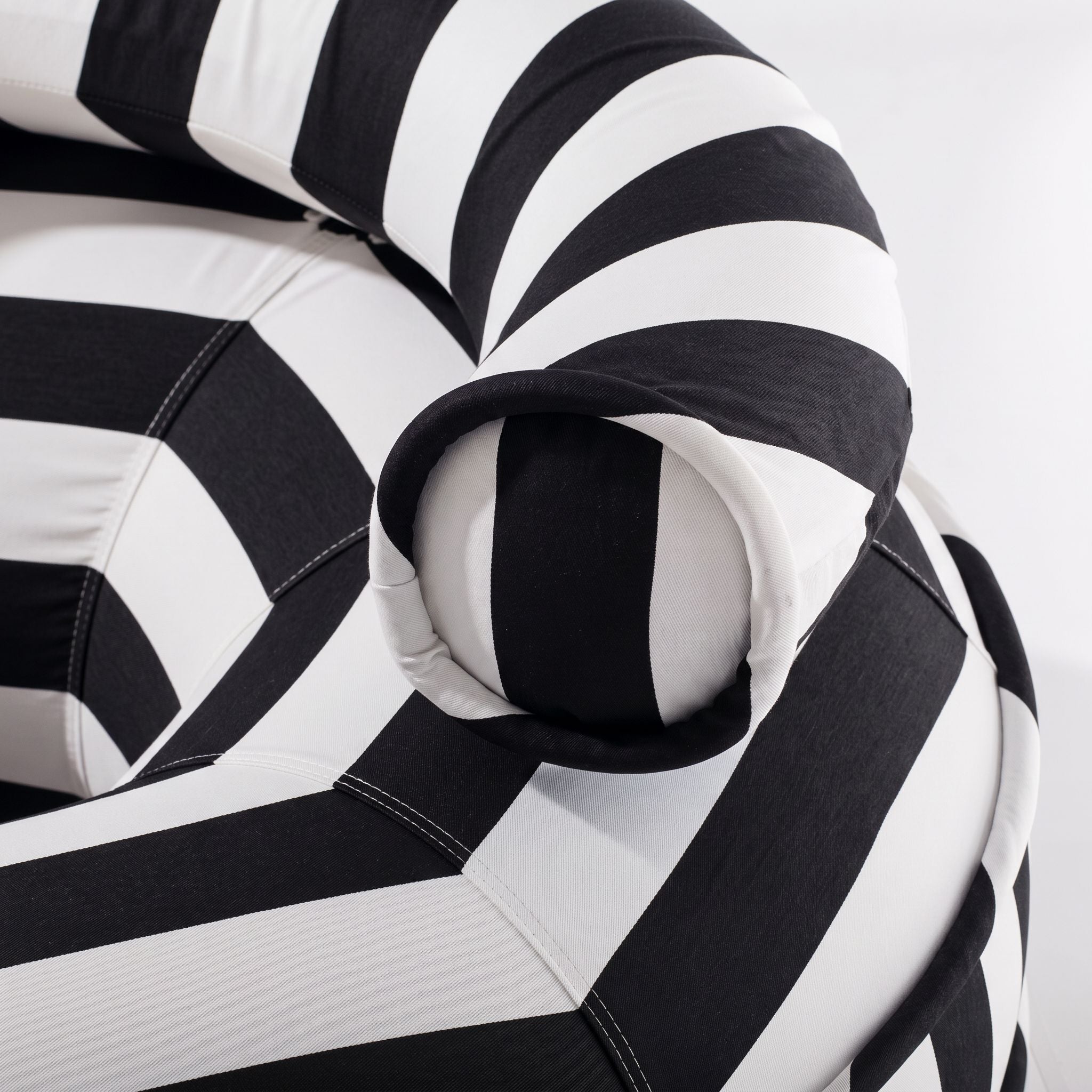 Close-up of a black and white striped pool float with striped pattern
