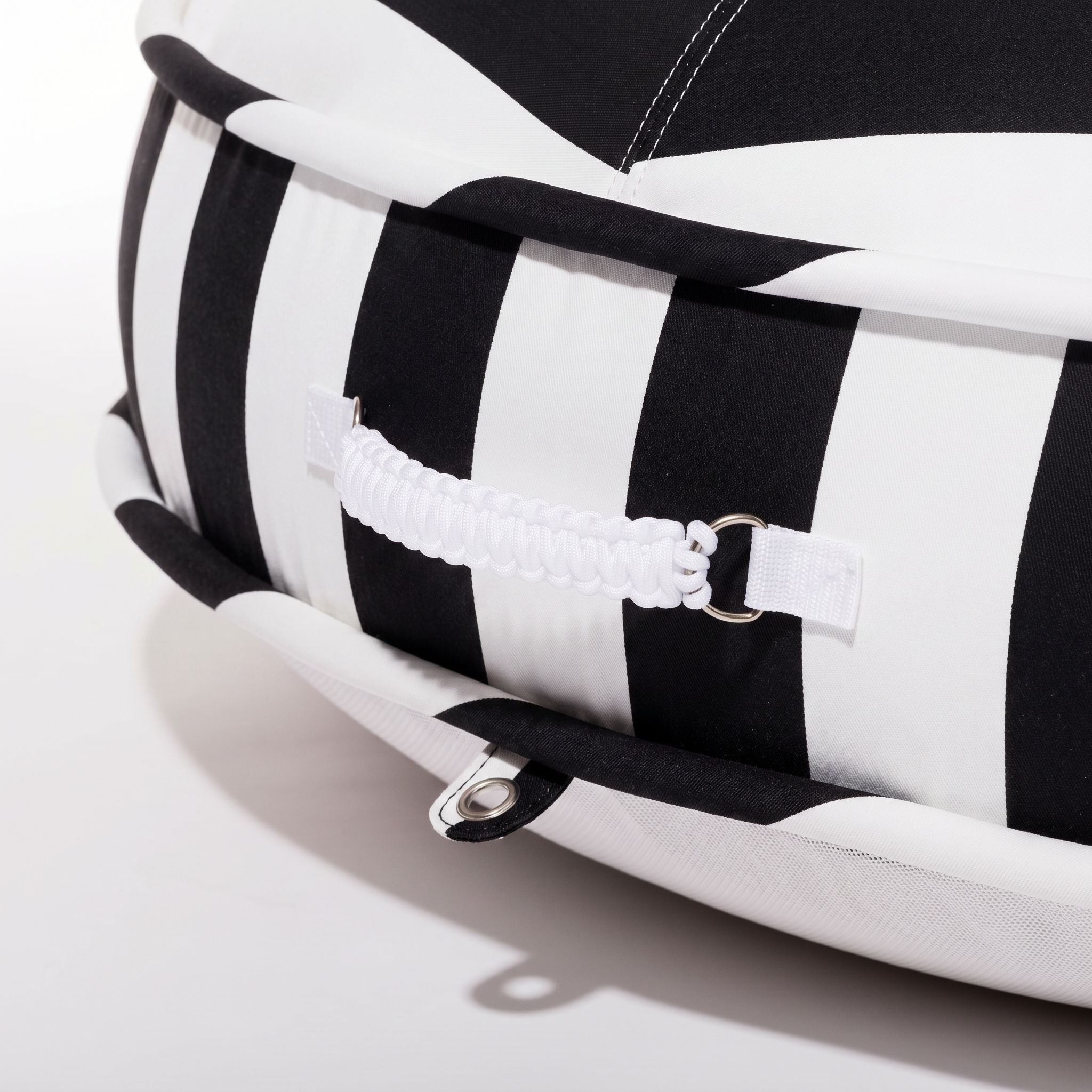 close up detail of a Black and white striped pool float 