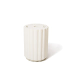 White ceramic vase with textured surface on a white background