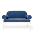 Blue sofa with cylindrical armrests on a white background