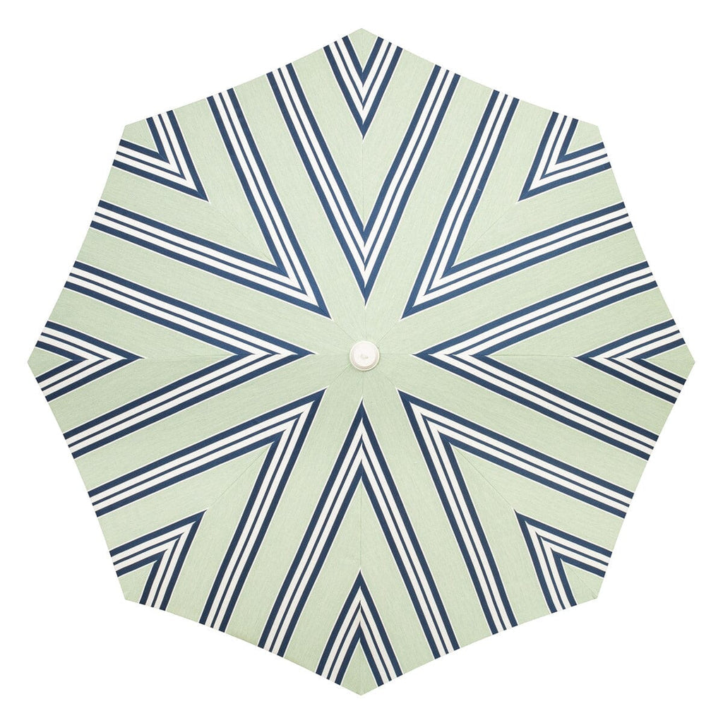 Hexagonal umbrella with blue and white striped pattern on a light green background