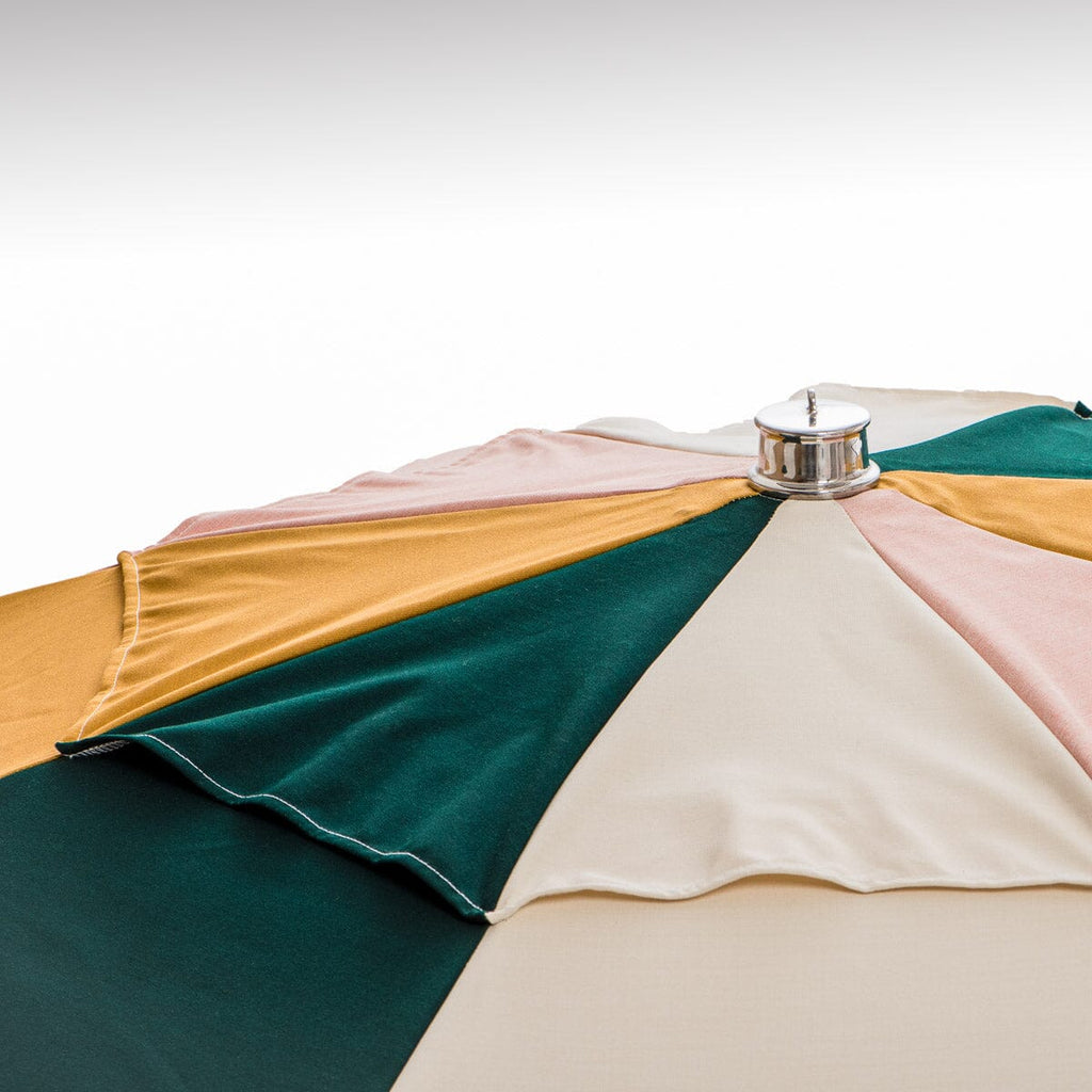 close up of top cap on colorful umbrella