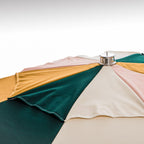 close up of top cap on colorful umbrella