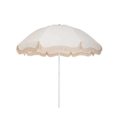 Business & Pleasure Co. Patio Umbrella in Antique White, featuring a dome-shaped ivory canopy with scalloped edges, cream fringe trim and a white center pole.
