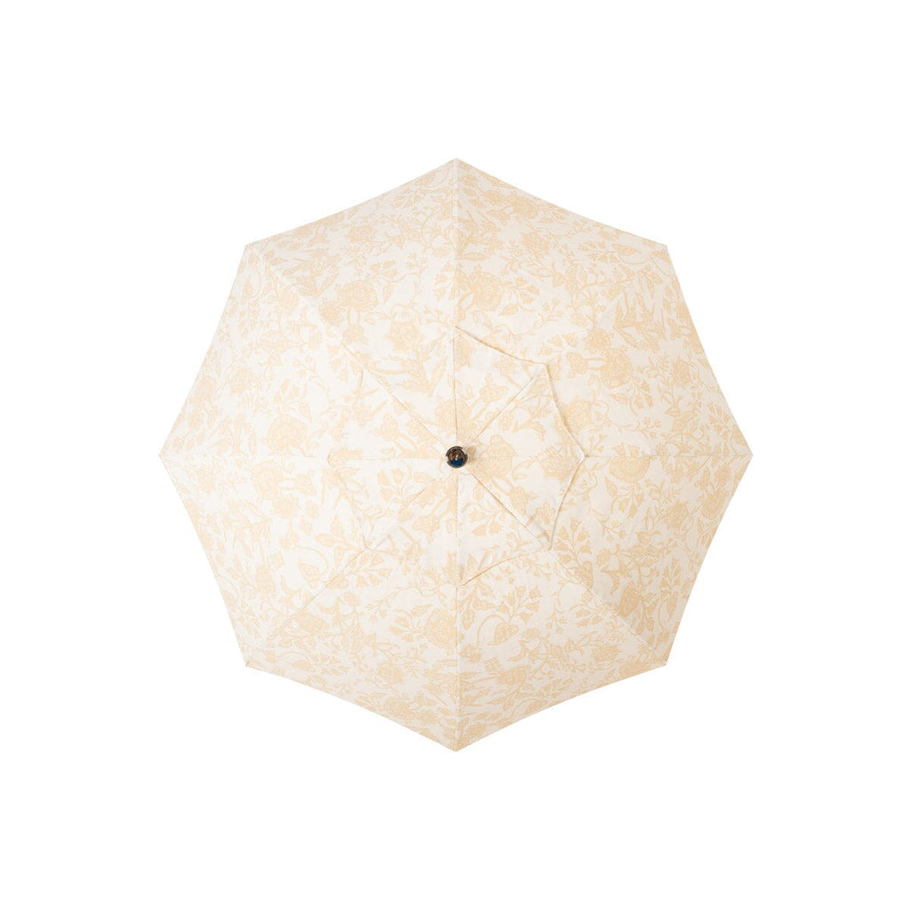 Beige umbrella with a floral pattern on a white background