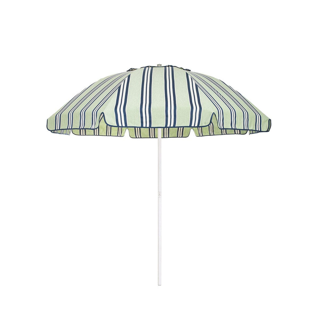 Business & Pleasure Co. Patio Umbrella in JBCO Green Stripes, featuring a dome-shaped pale green canopy with navy and white stripes, scalloped edges, navy piping and a white center pole.