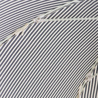 close up of canopy ties on navy stripe patio umbrella