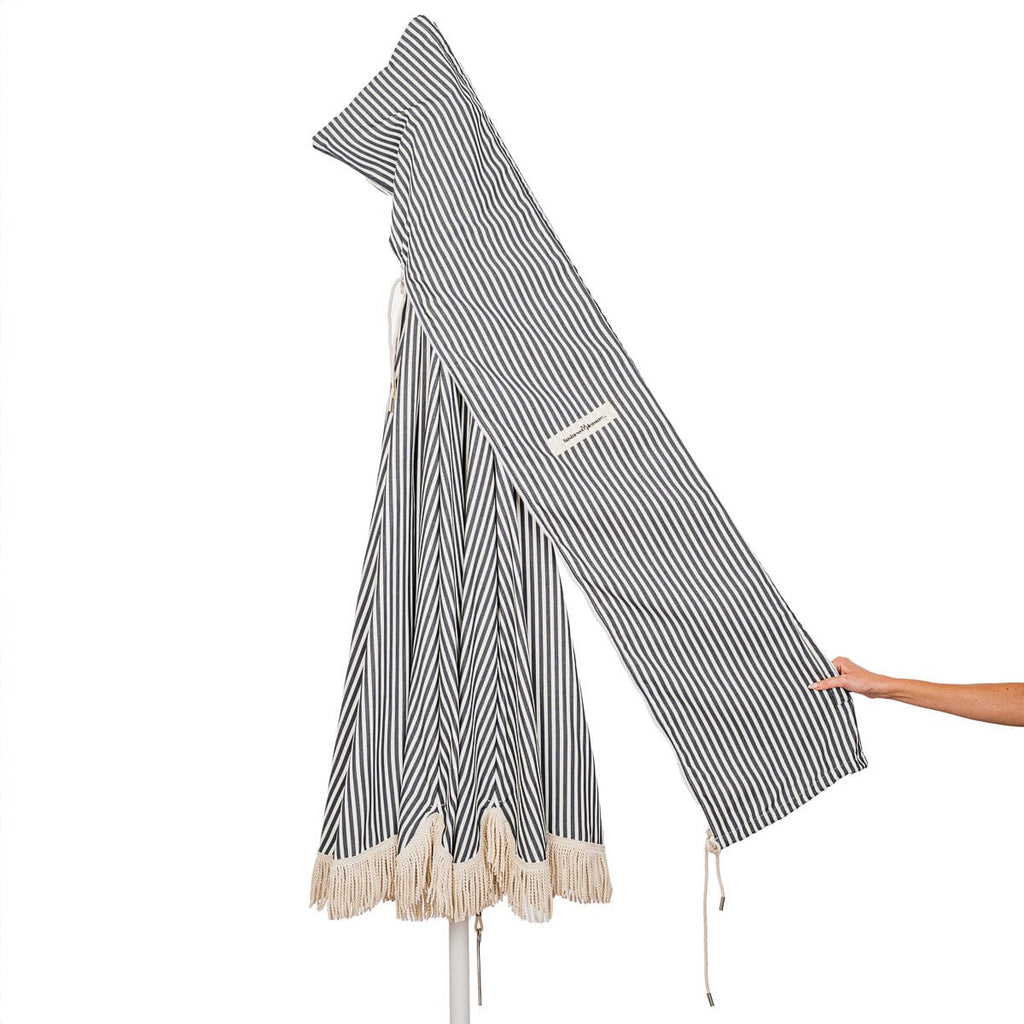 carry bag detail on navy stripe patio umbrella