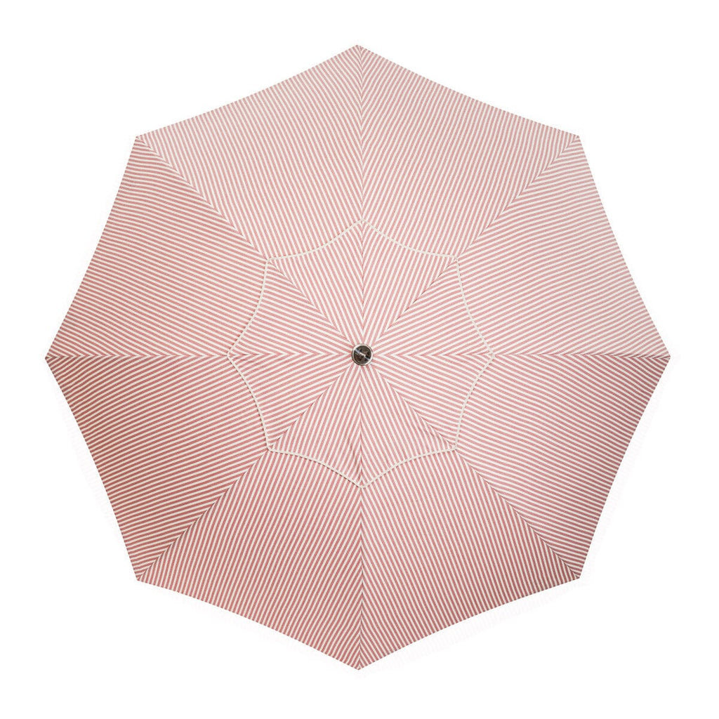 pink stripe umbrella on white background top down view
