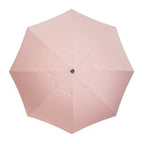 pink stripe umbrella on white background top down view