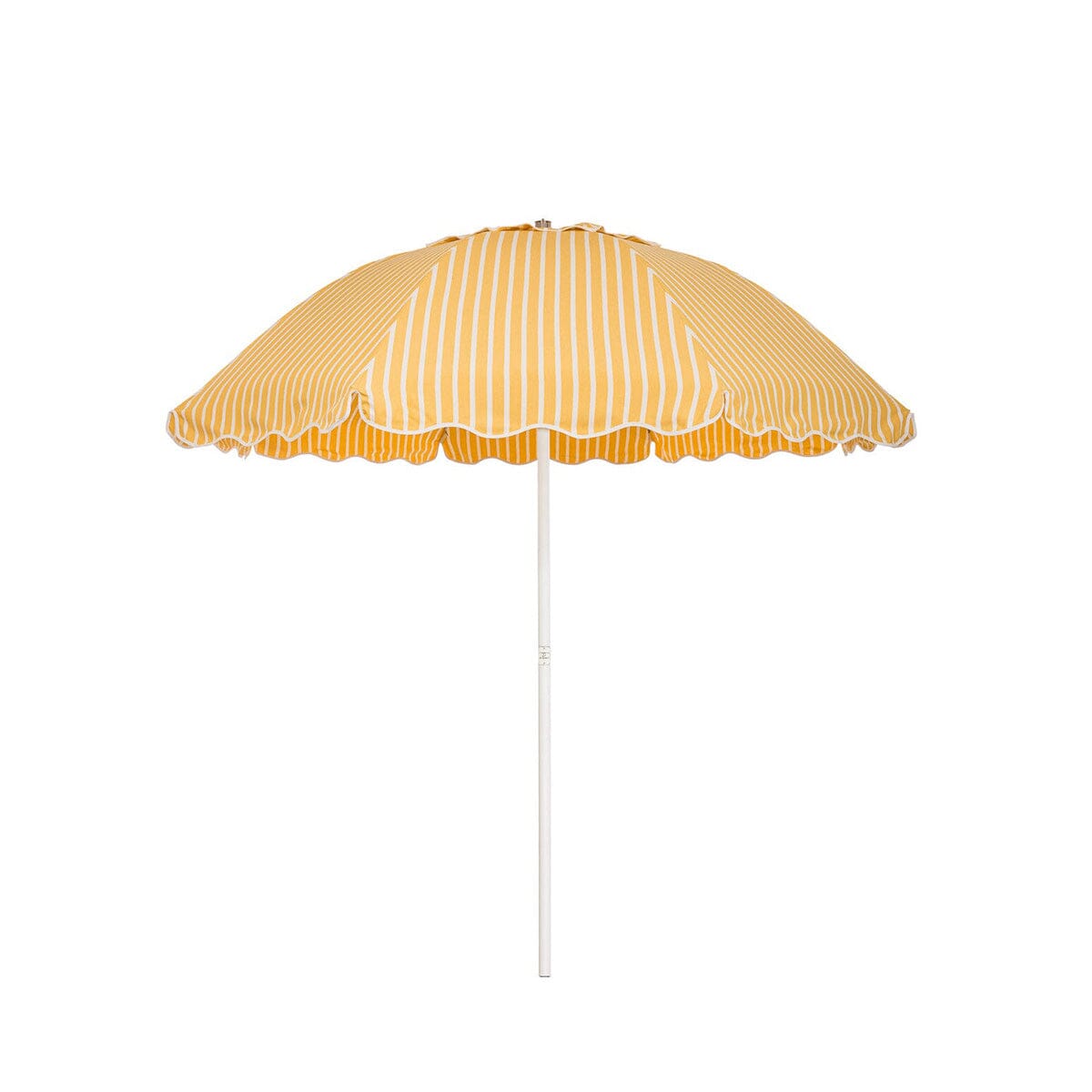 Business & Pleasure Co. Patio Umbrella in Monaco Mimosa Stripe, featuring a dome-shaped golden yellow and white striped canopy with scalloped edges, white piping and a white center pole.