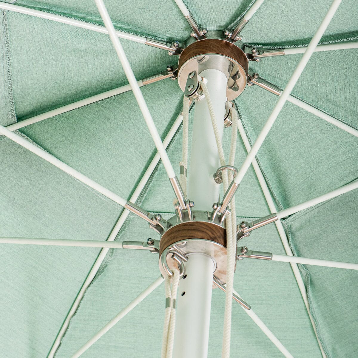 close up hardware detail on green patio umbrella