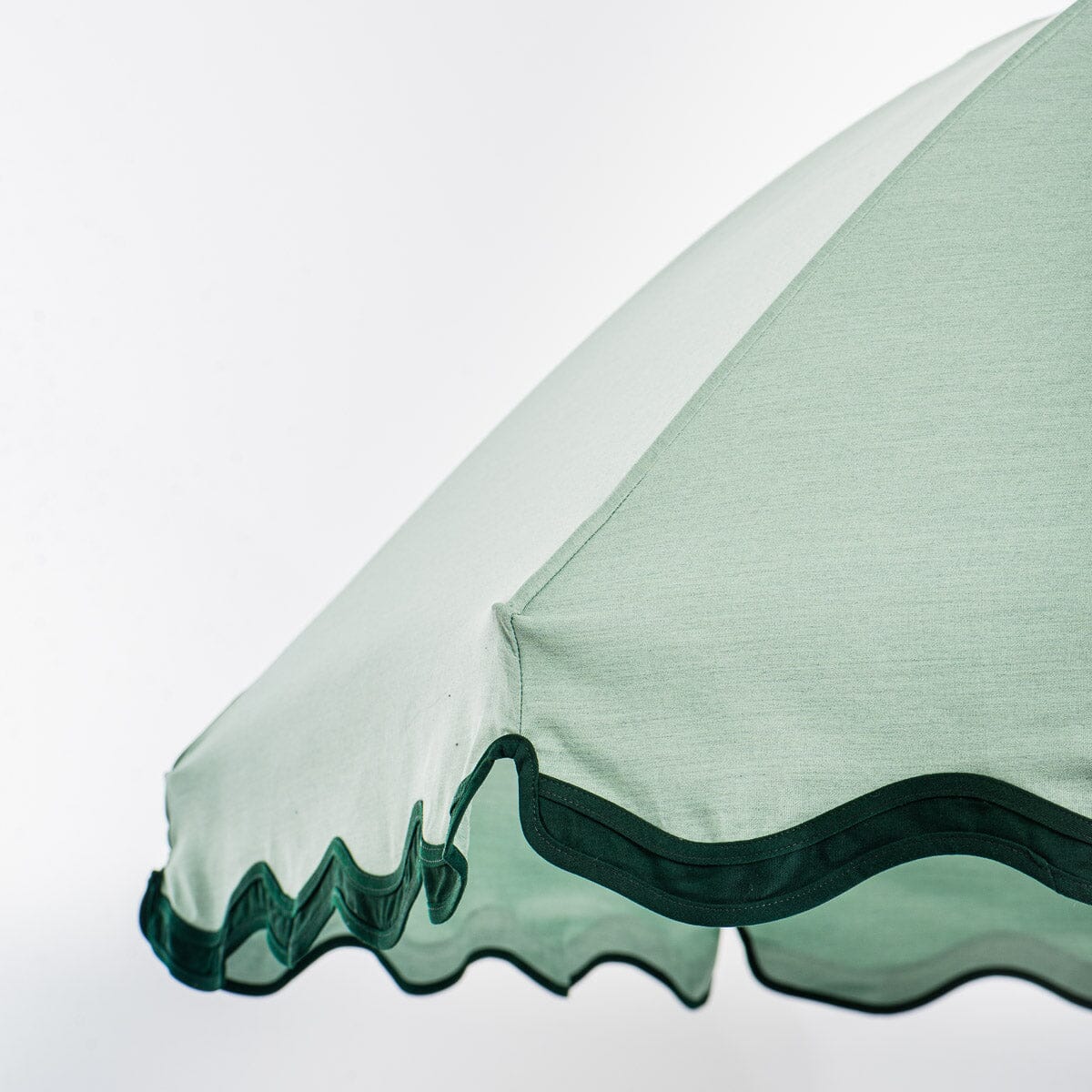 canopy edge detail on green patio umbrella