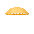 Business & Pleasure Co. Patio Umbrella in Rivie Mimosa, featuring a dome-shaped golden yellow canopy with scalloped edges, contrasting cream wave trim and a white center pole.