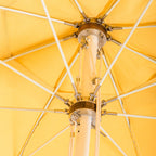 close up hardware detail on yellow patio umbrella