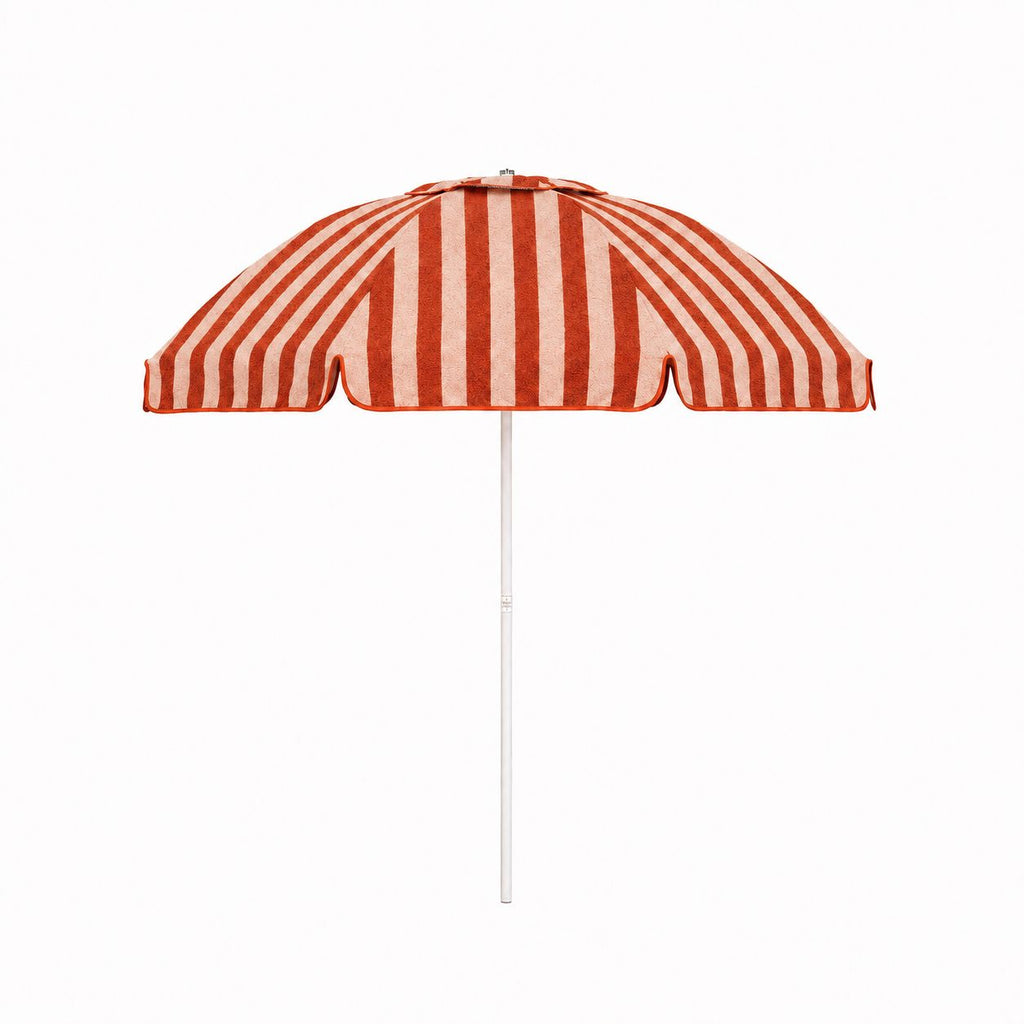The Patio Umbrella in Terry Terracotta Stripe by Business & Pleasure Co. features a red and slightly pink/taupe stripe dome canopy in our new pleasuretex® fabrication with a white pole. Made for your home, patio, outdoor dining experiences.