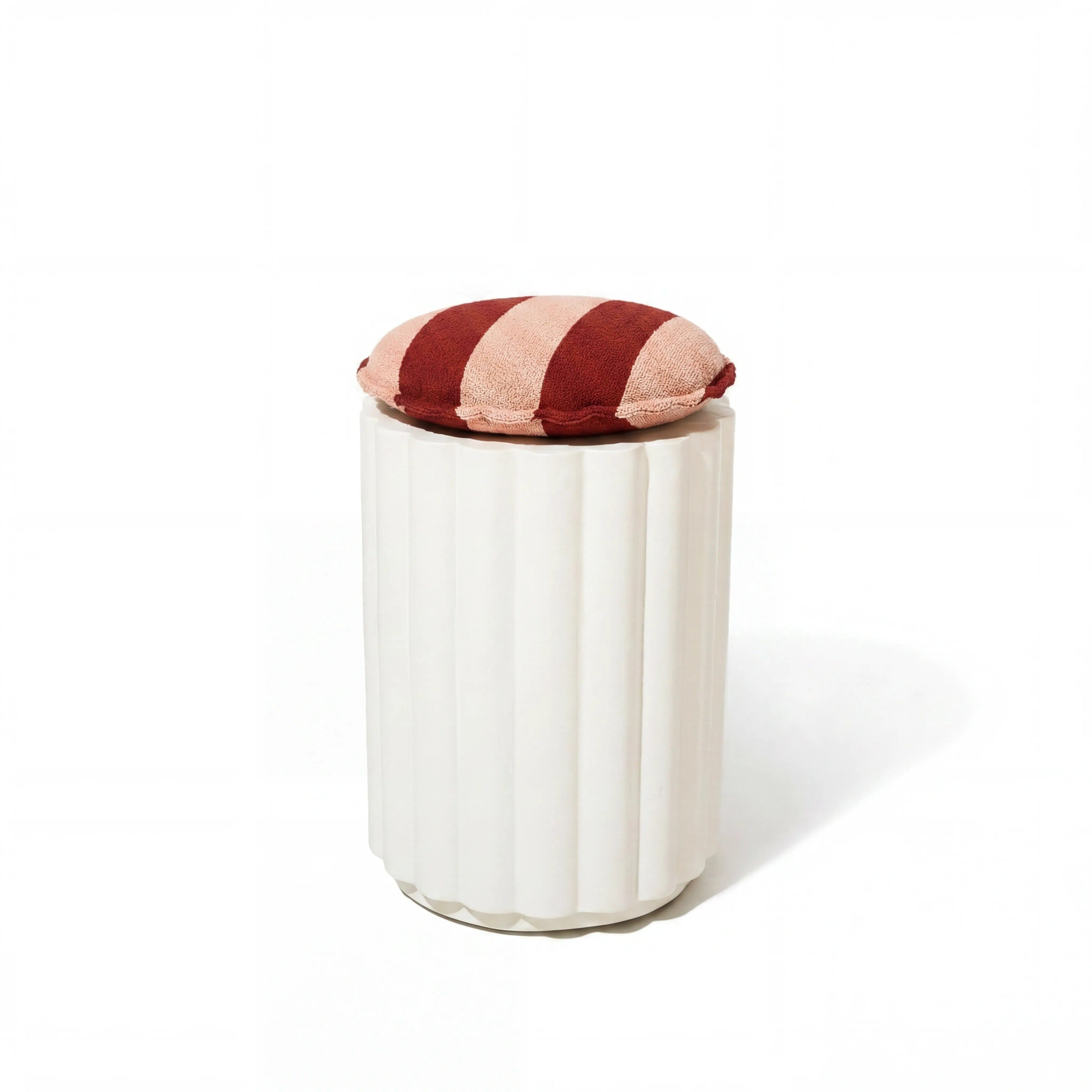 Terry Terracotta stripe cushion on cement daisy stool base in white