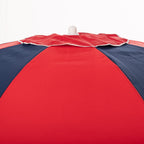 Red and navy beach umbrella on a white background