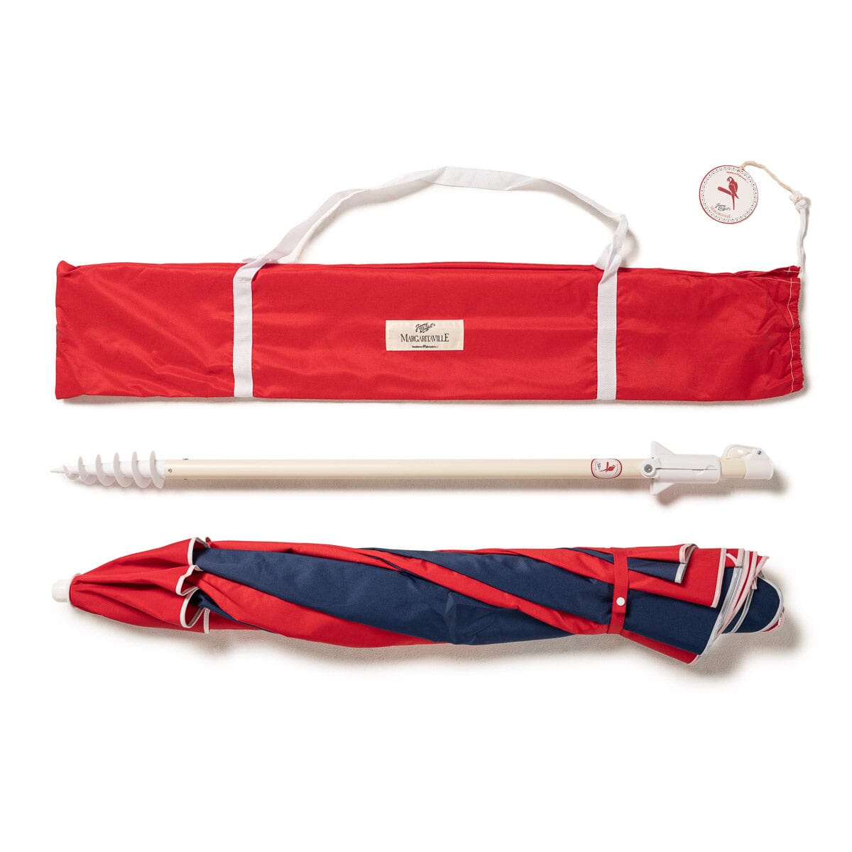 Red and navy beach umbrella on a white background