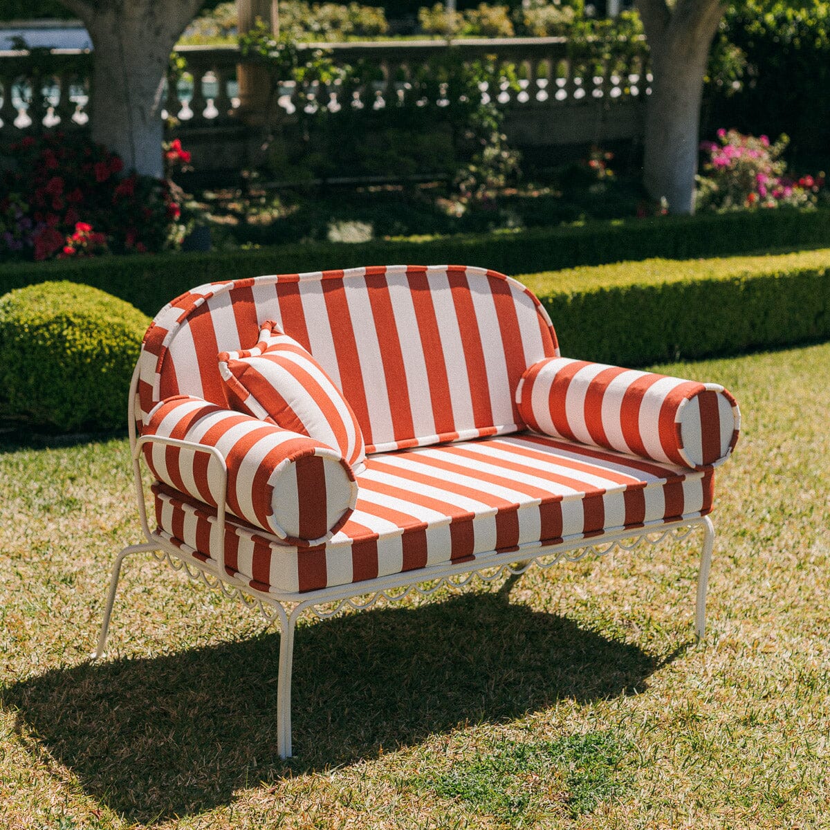The Al Fresco Love Seat in Crew Le Sirenuse Stripe | Antique White Frame Bundle Business & Pleasure Co. 