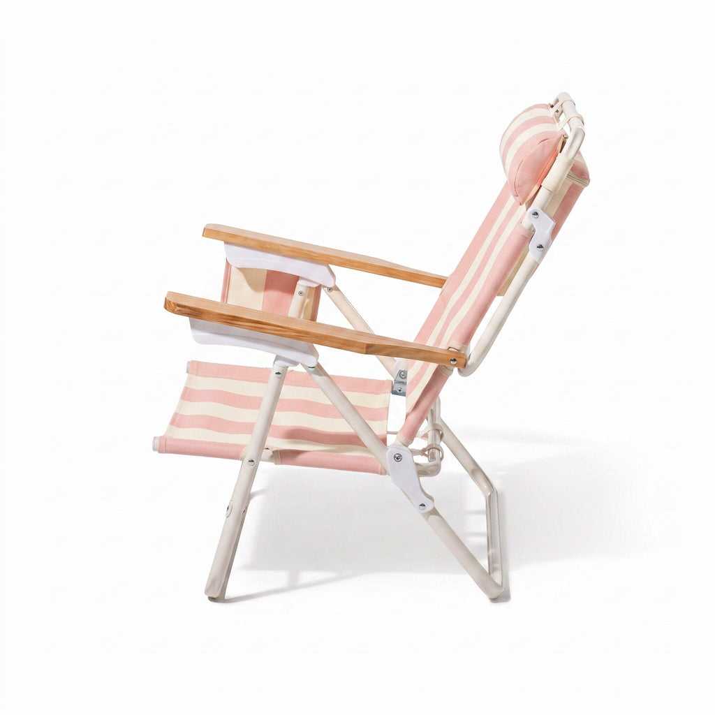 Foldable chair with pink and white striped design on a white background