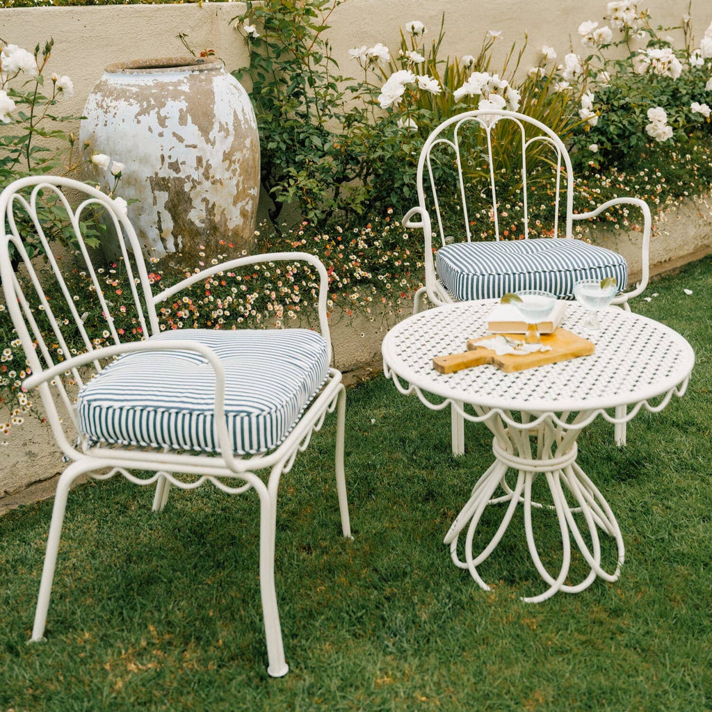 Navy al fresco chairs in a garden