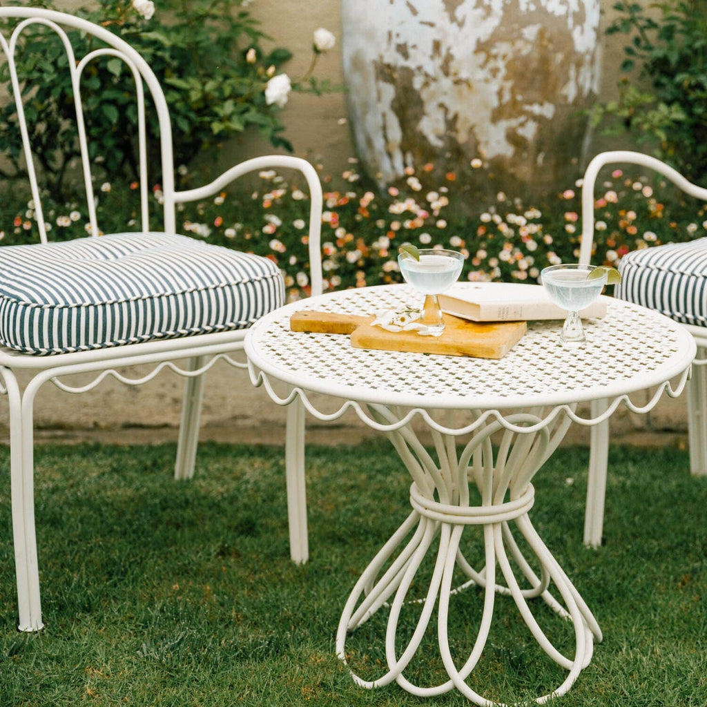 Navy al fresco chairs in a garden