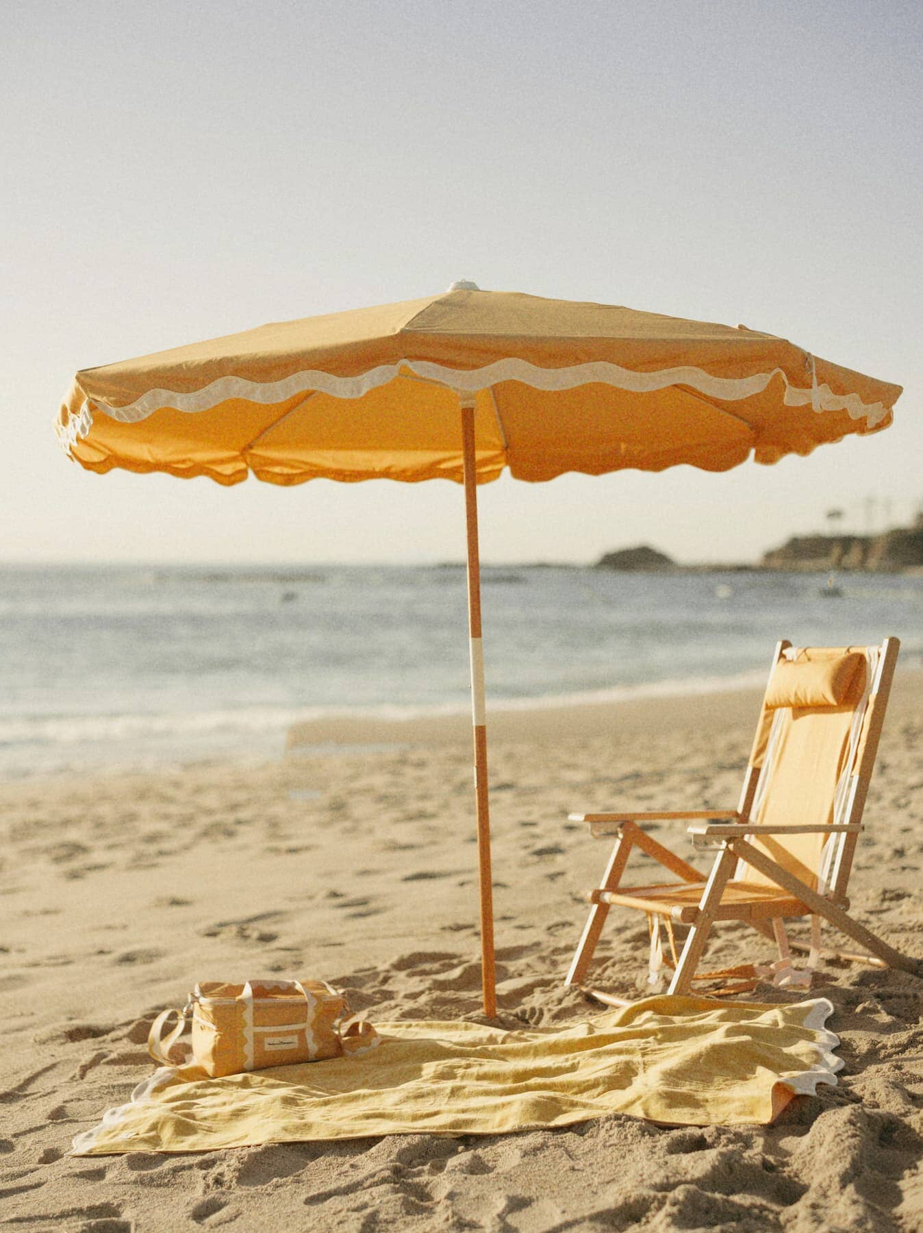 Riviera mimosa beach set up with umbrella, chair, blanket and cooler