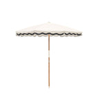 White beach umbrella with dark navy trim on a white background