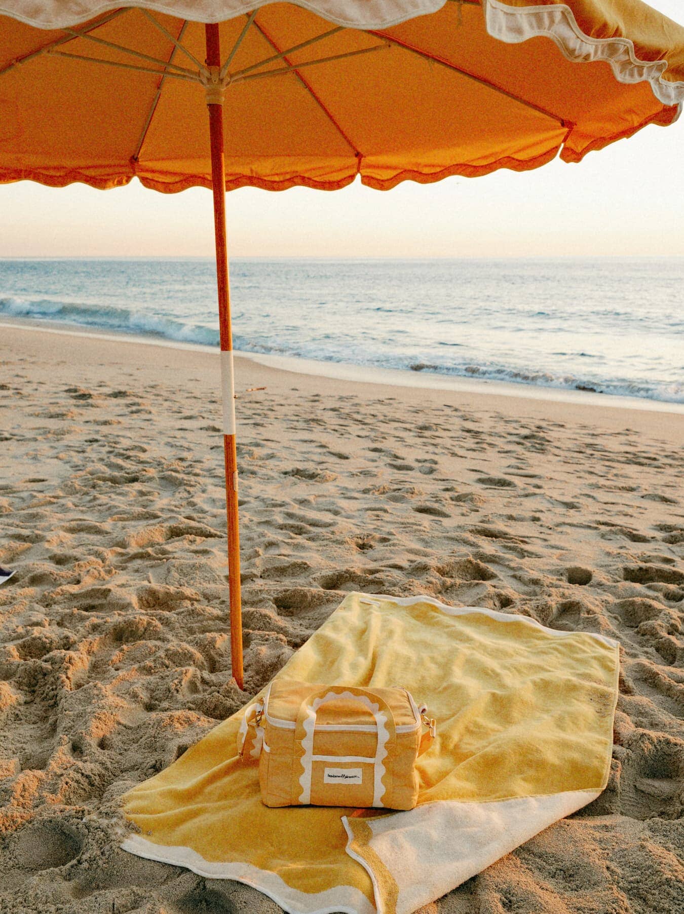 Riviera mimosa beach set up with towel, umbrella and cooler