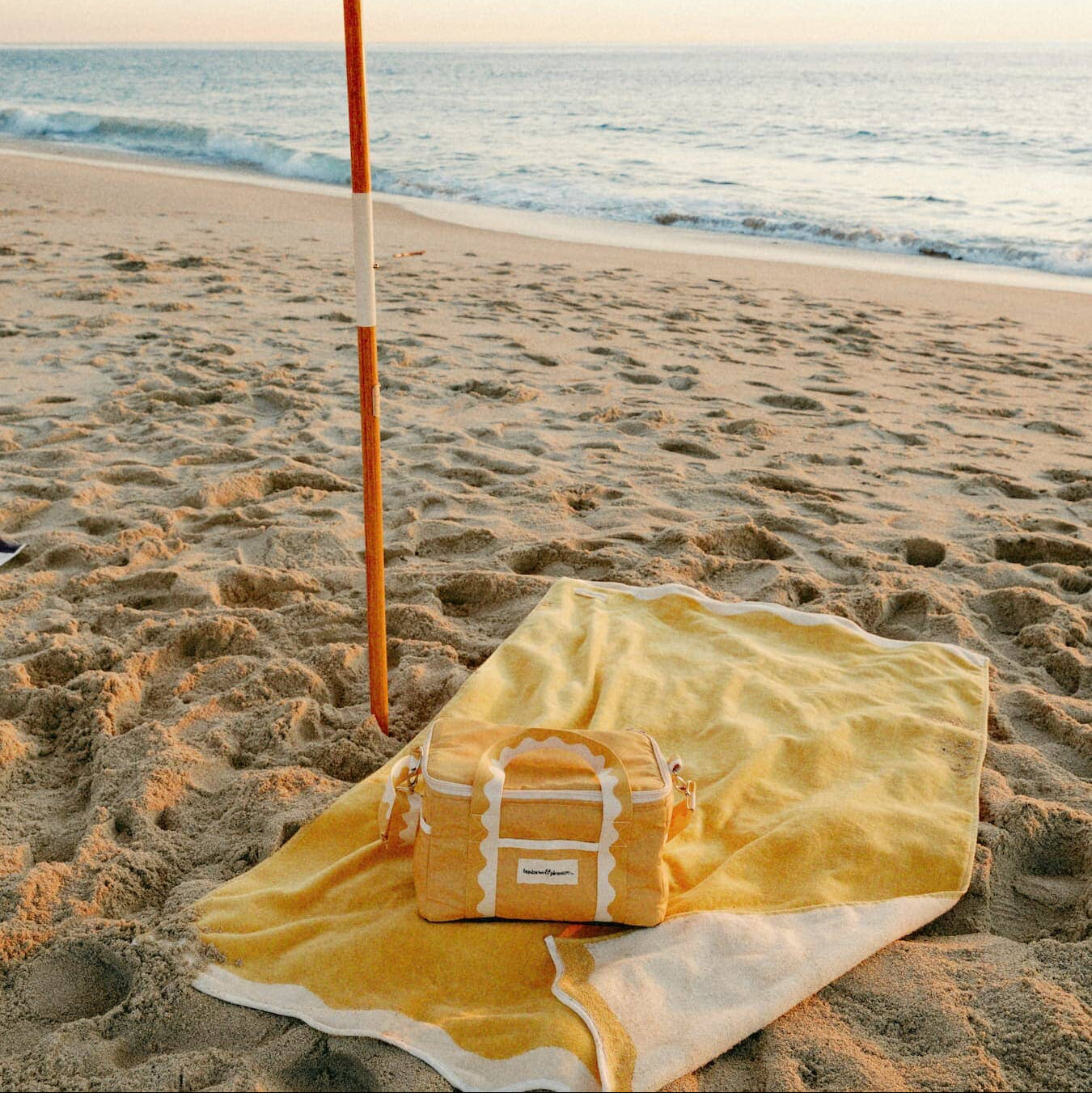 Riviera mimosa beach set up with towel, umbrella and cooler