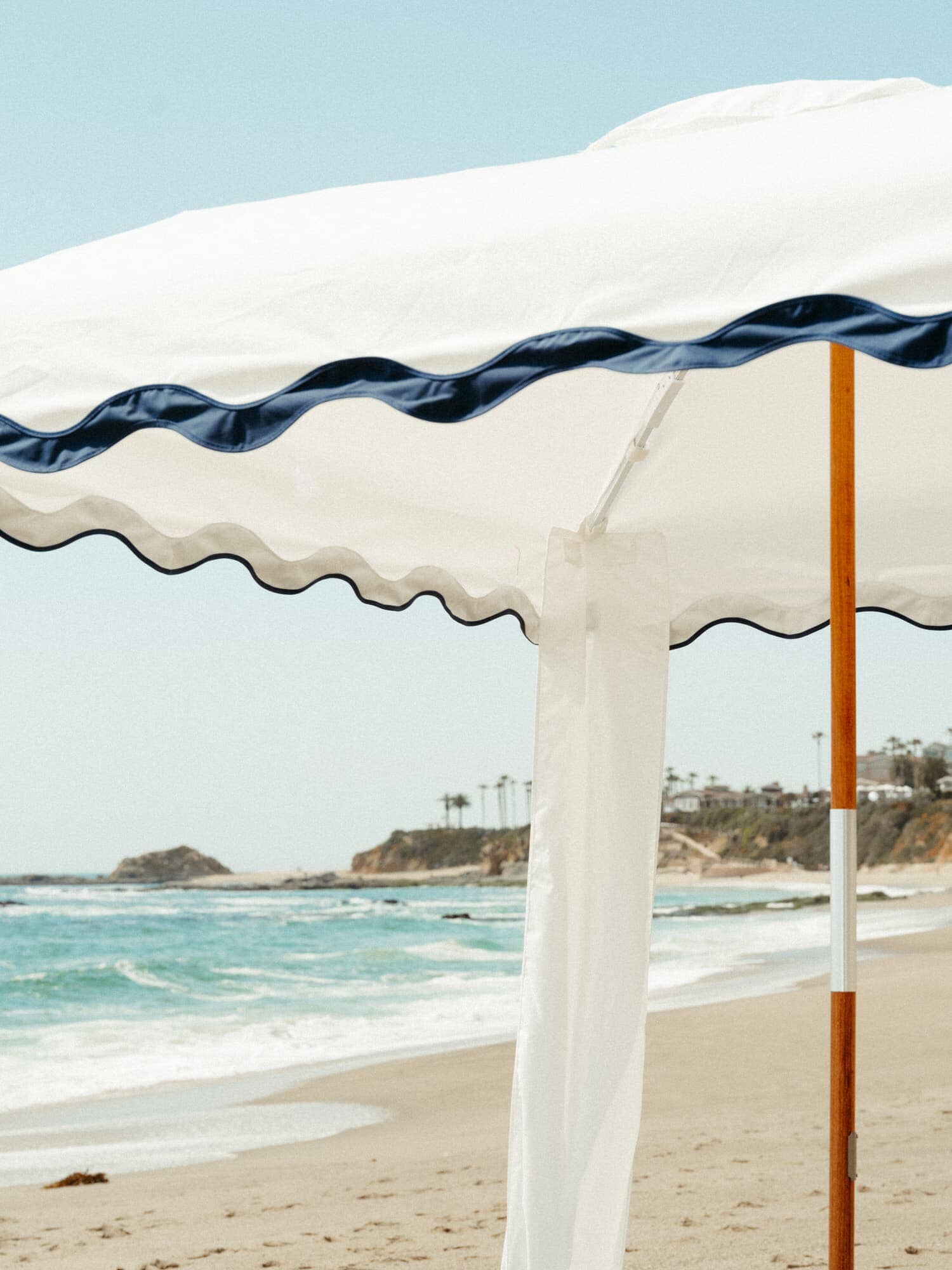 Riviera white cabana with matching accessories on the beach