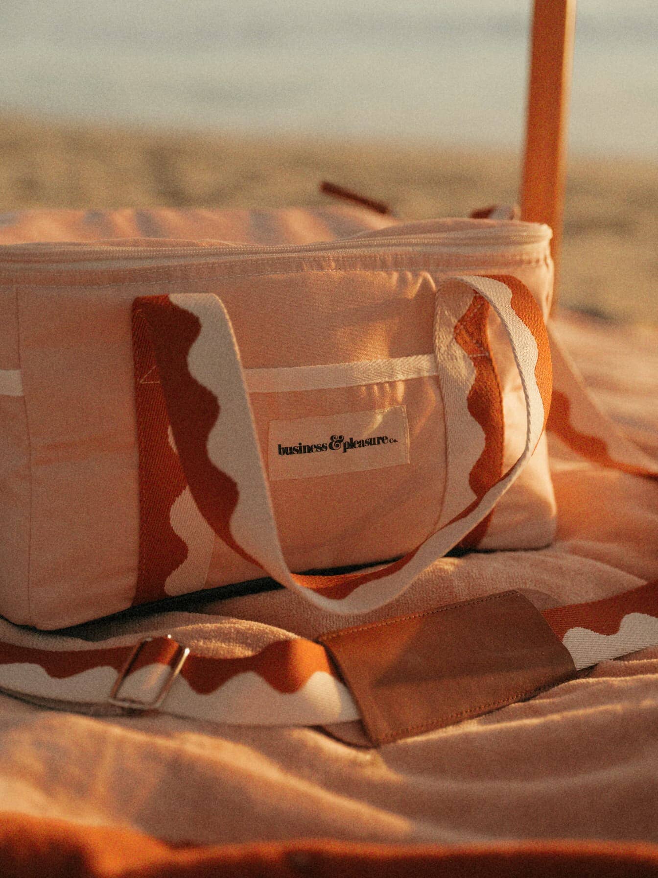 beach setting with riviera pink cooler bag