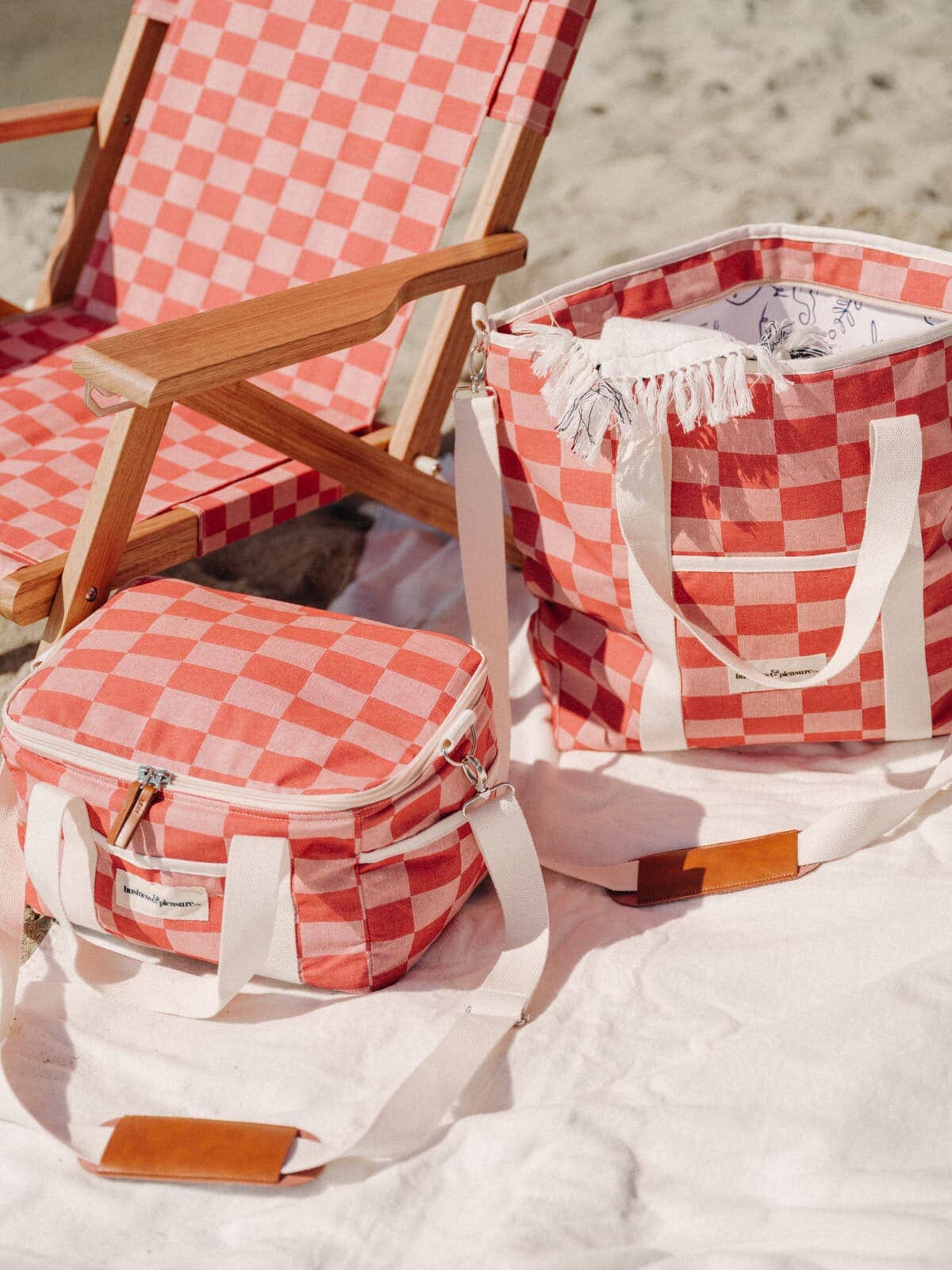 Beach picnic set up with le sirenuse check coolers and tommy chair