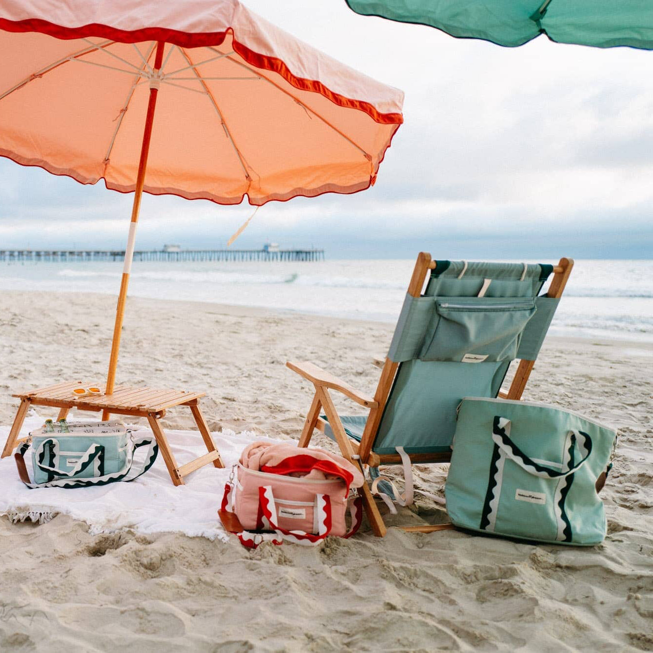 Rivie beach set up with umbrellas, chairs and coolers