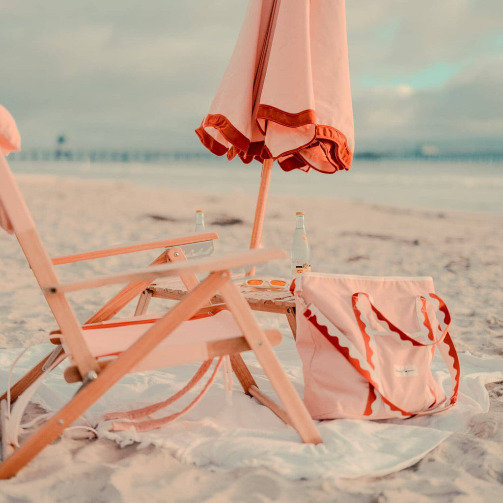 Rivie pink beach set up with chair, umbrella and cooler tote
