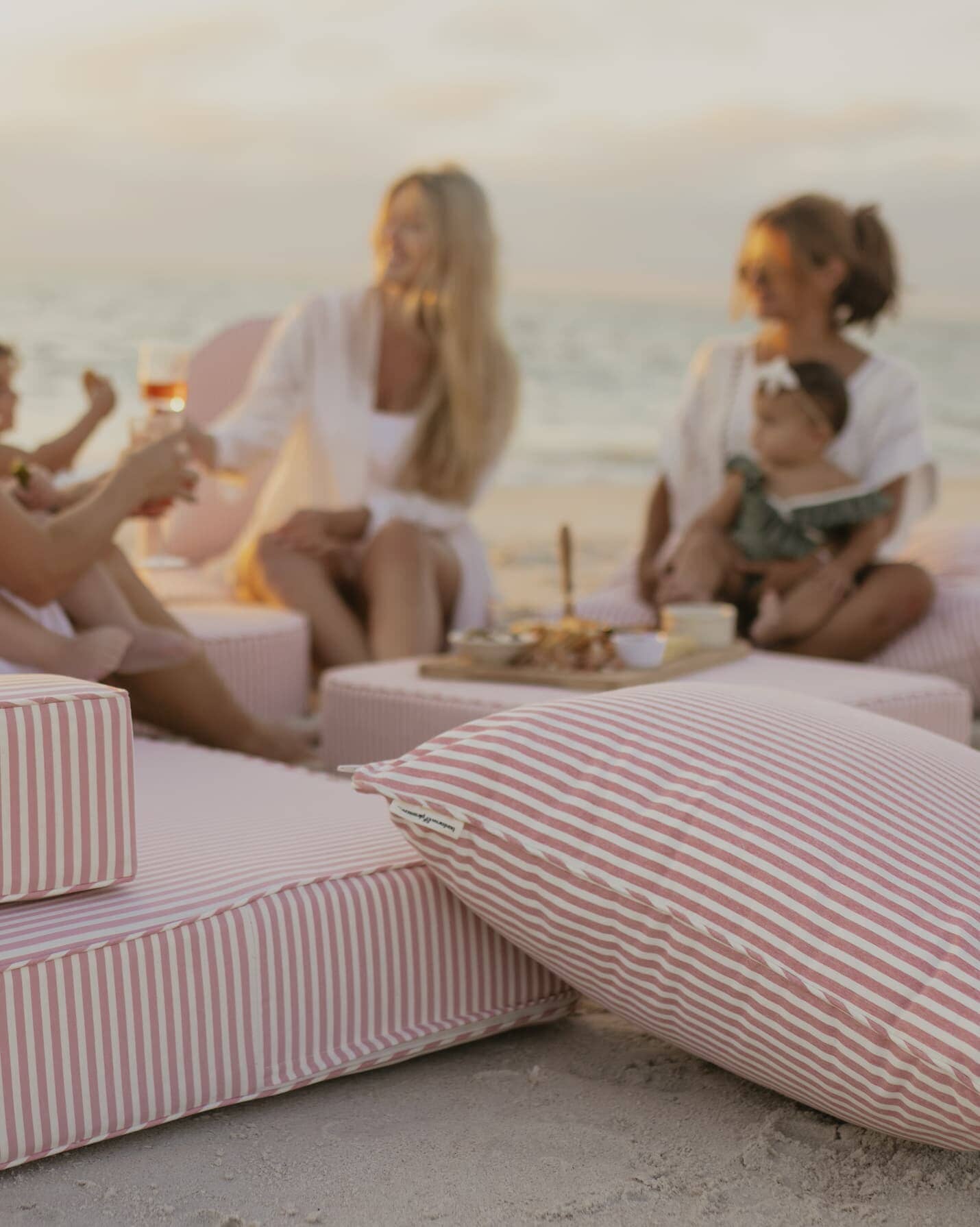 beach picnic with the laurens pink stripe cushion collection