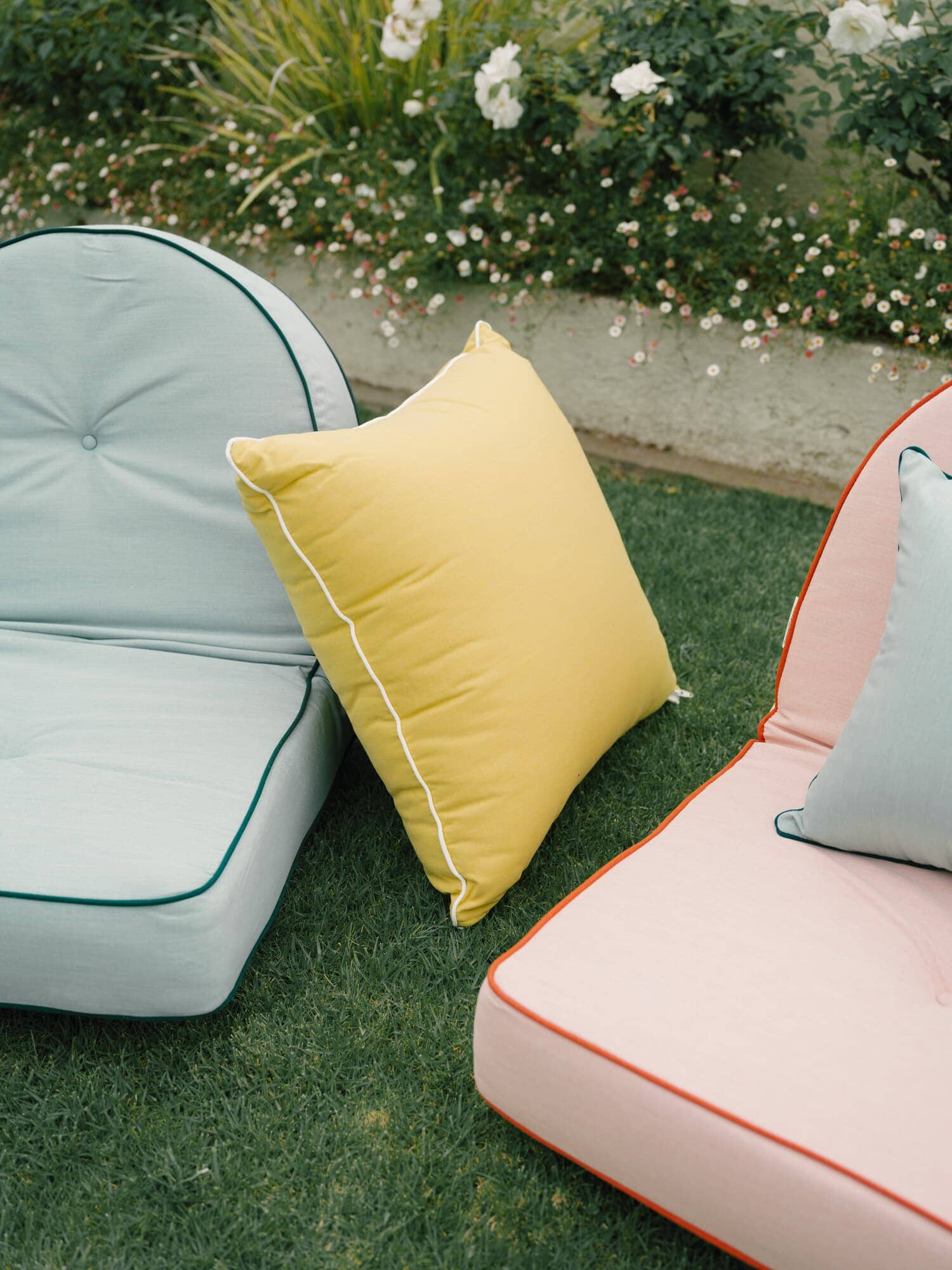 Colored outdoor cushions on grass