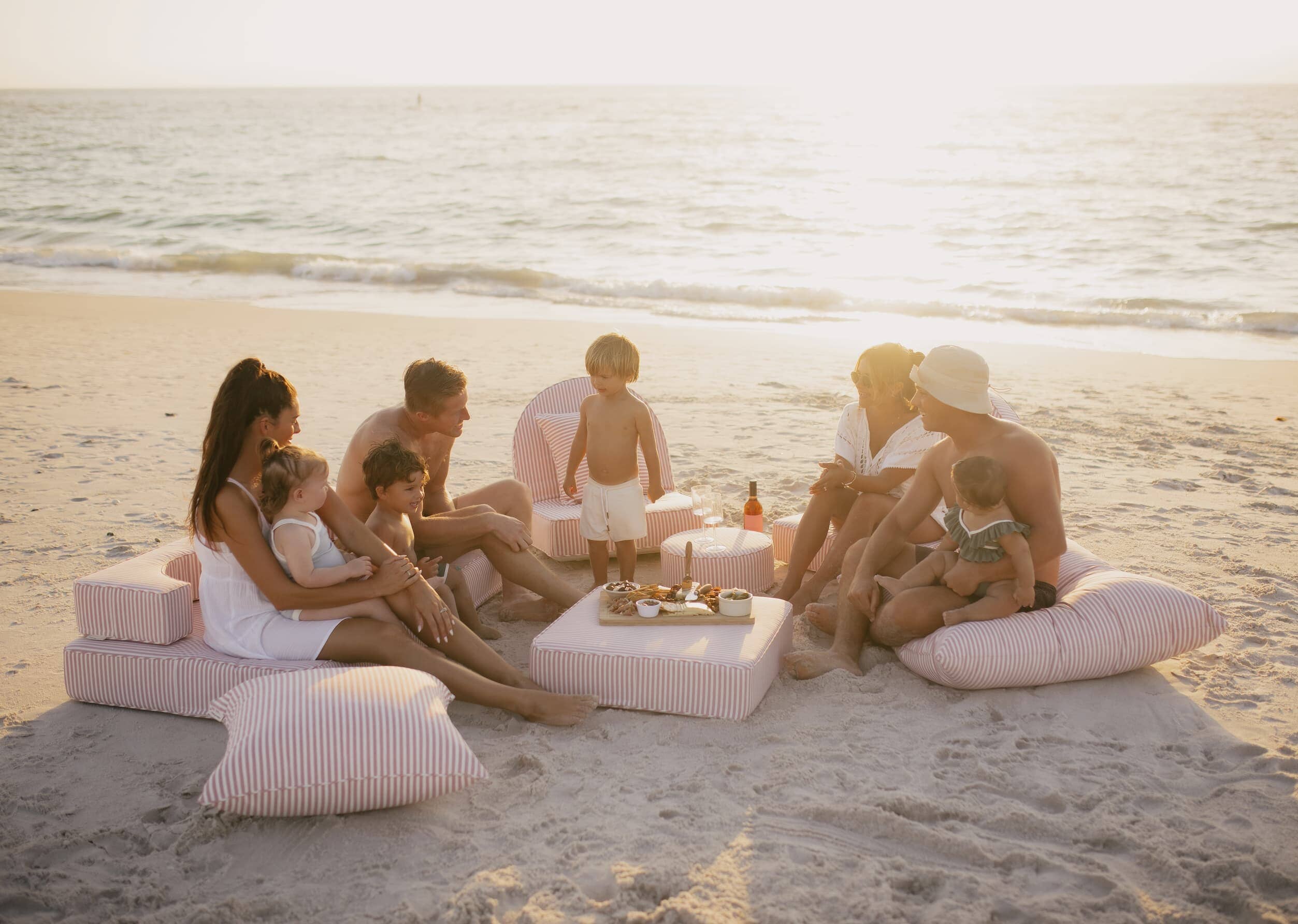 picnic with the pink cushion collection on the beach