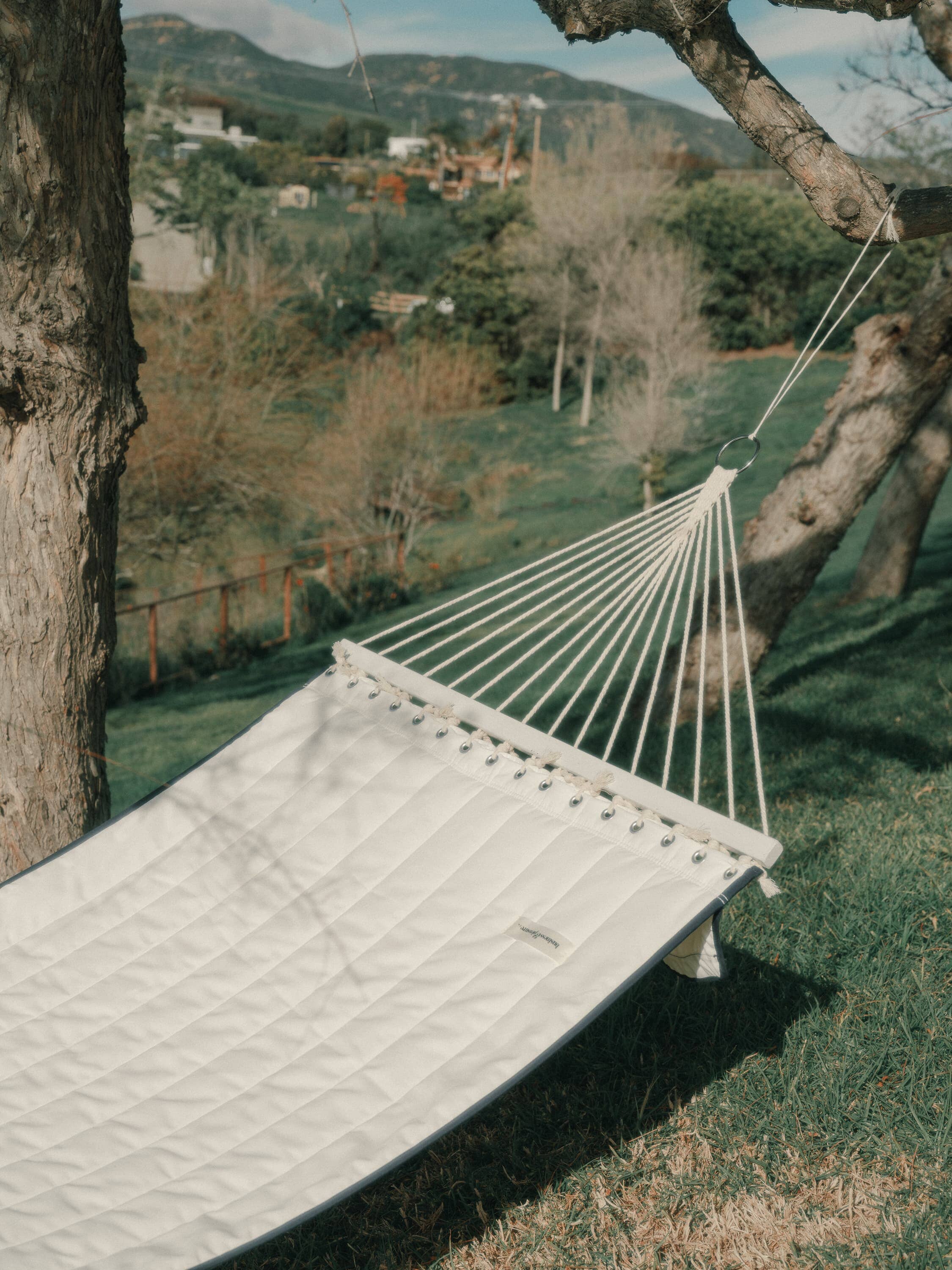 riviera white hammock in a garden