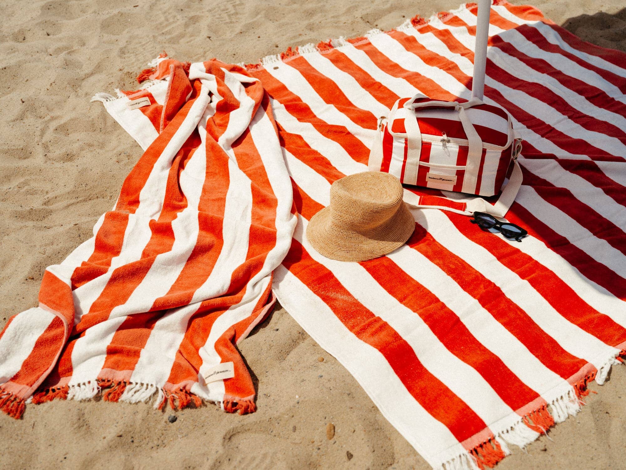 Le sirenuse holiday blanket, towel and cooler on the sand